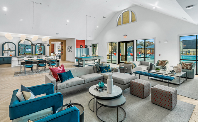 Resident lounge overlooking resort-style pool