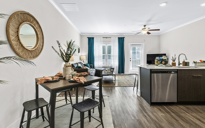 Open kitchen layout looking into furnished living room