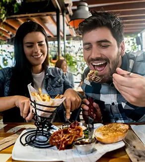 young adults enjoying dinner at a restaurant